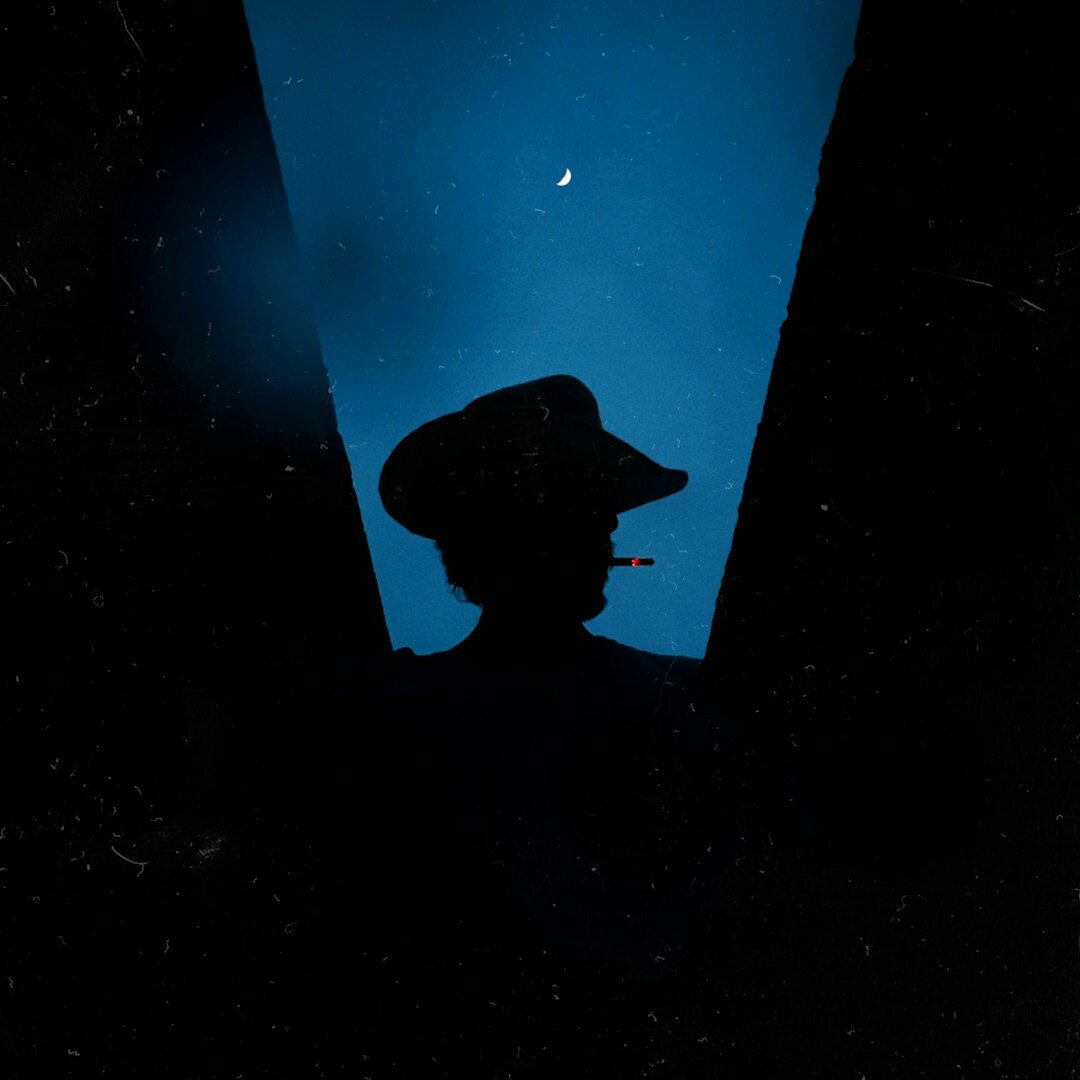 Dark navy book cover with a silhouette and magnifying glass for a detective novel titled La Sombra Porteña