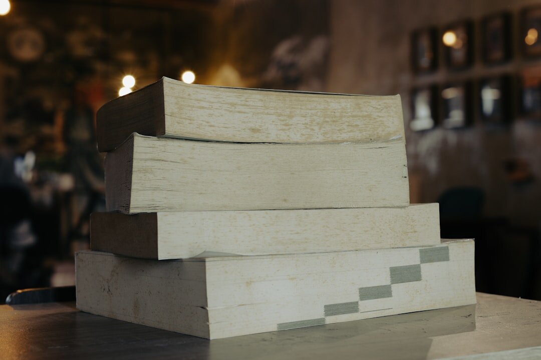 stack of mystery books on table